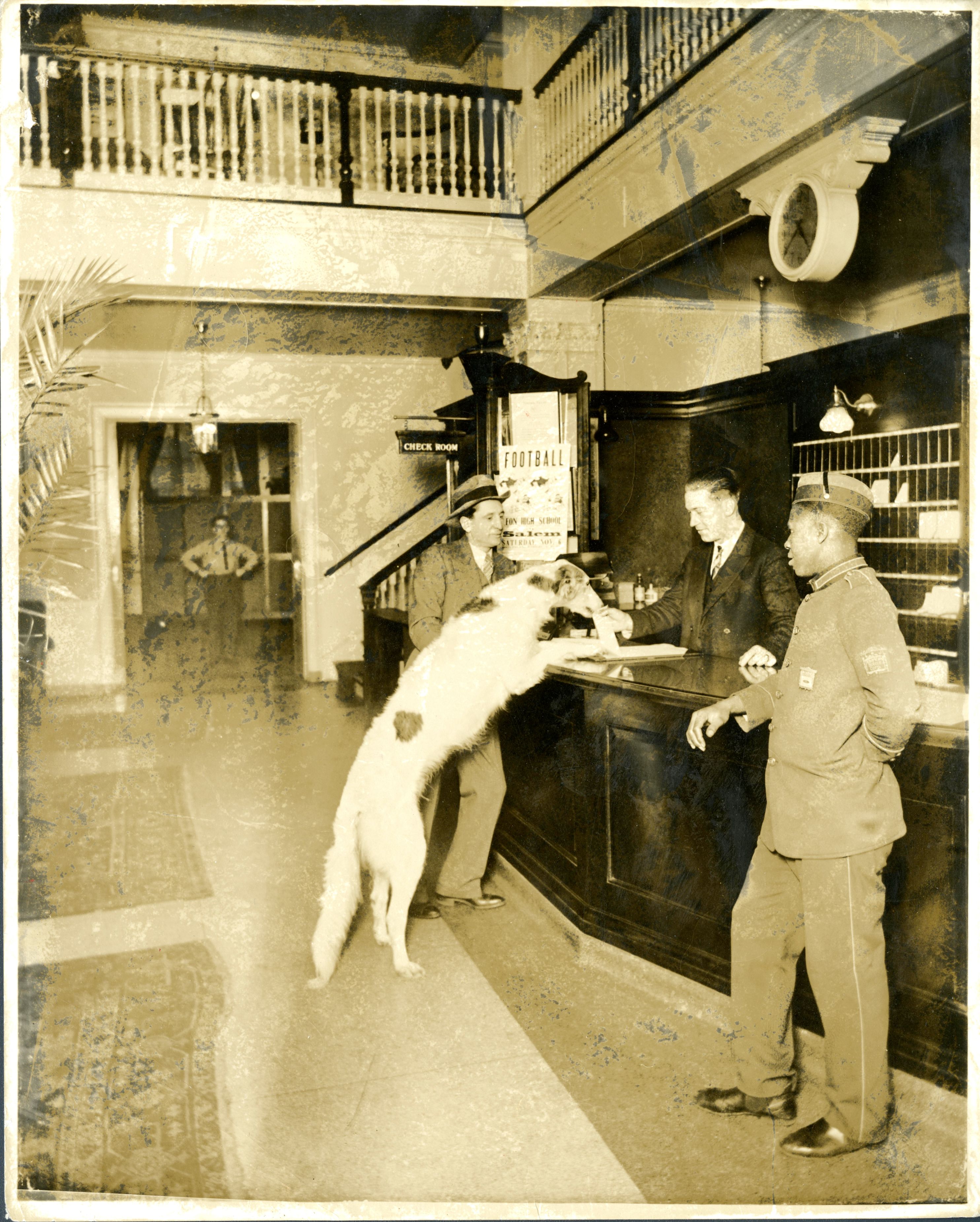 Historical image of 1920s front desk at The Hawthorne Hotel with bellhop, and 1920’s gentlemen attire. Hawthorne Hotel, a member of Historic Hotels of America since 1991, located in Salem, Massachusetts